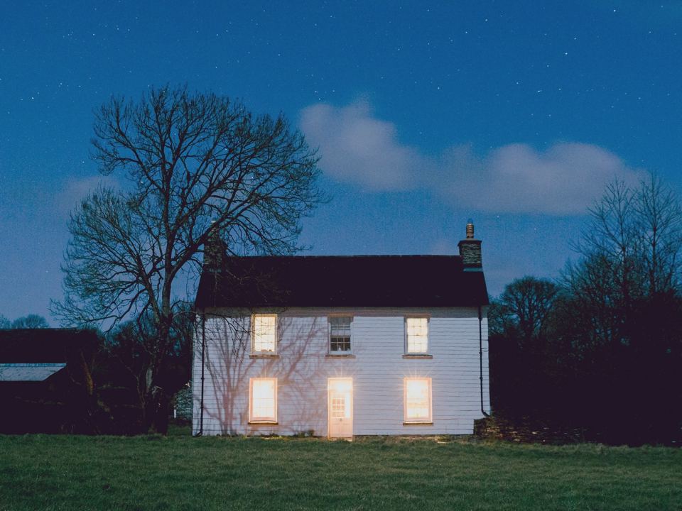Ty fforest farmhouse at night