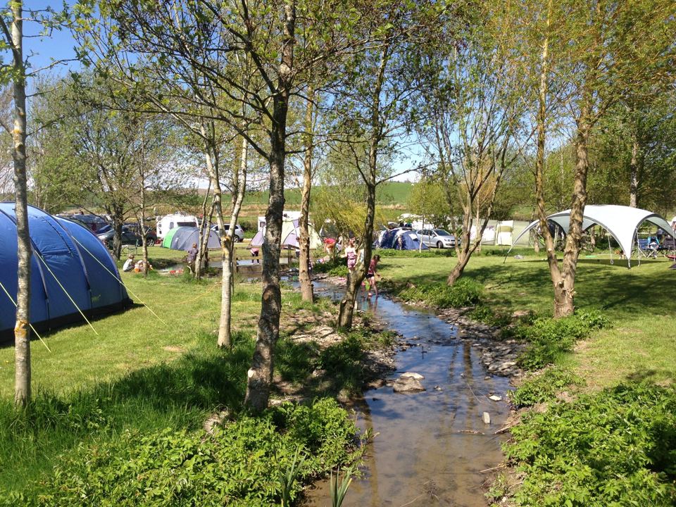 Tents beside the stream