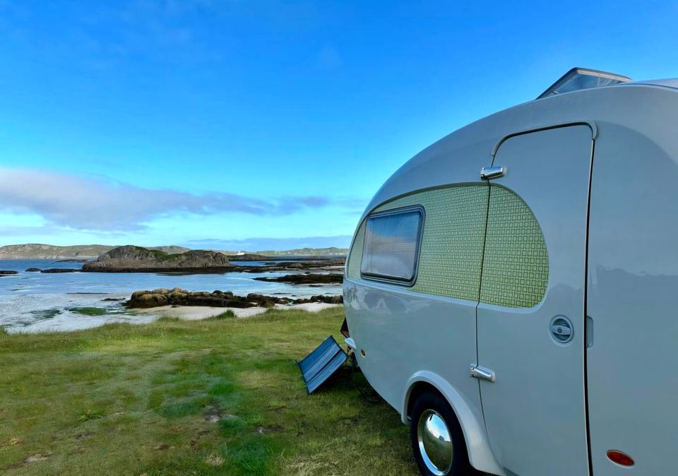 Small caravan by the water