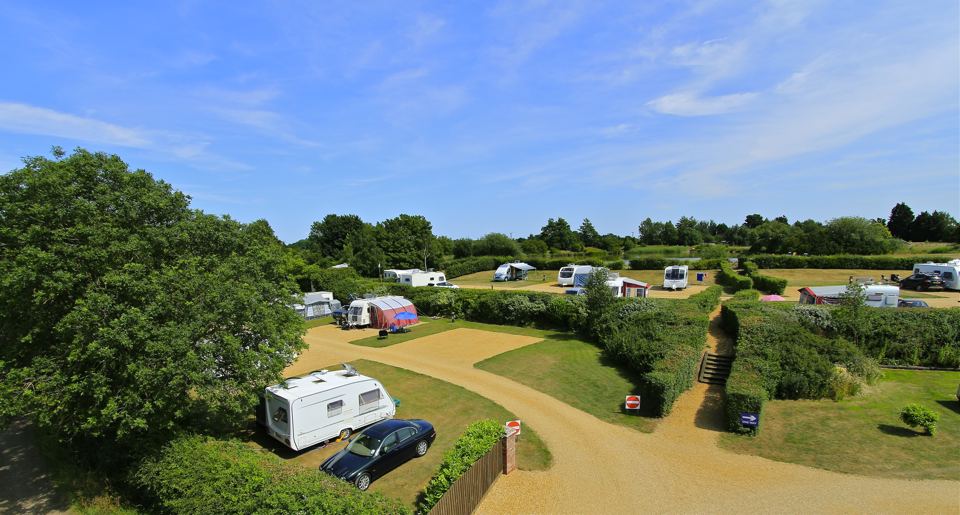 Serviced pitches among the hedges
