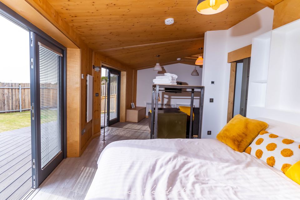 Bed by the glass doors