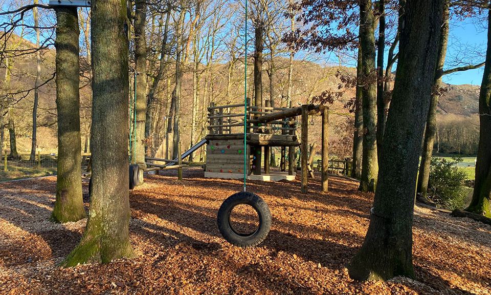 Tyre swing in the woodland play area
