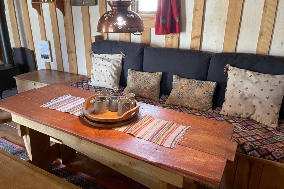 Sofa and table inside a cabin