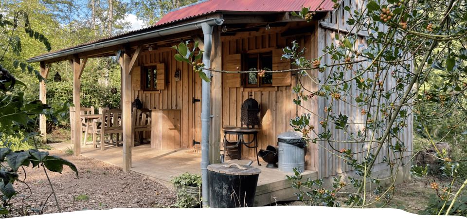 Cabin porch among the hedges
