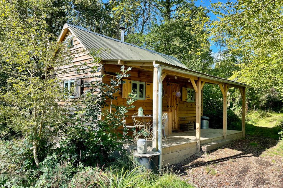 Cabin with veranda in the woods