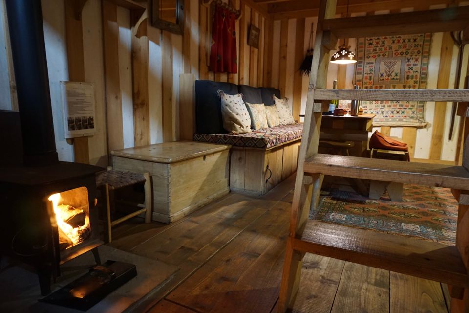 Woodburner and mezzanine bed