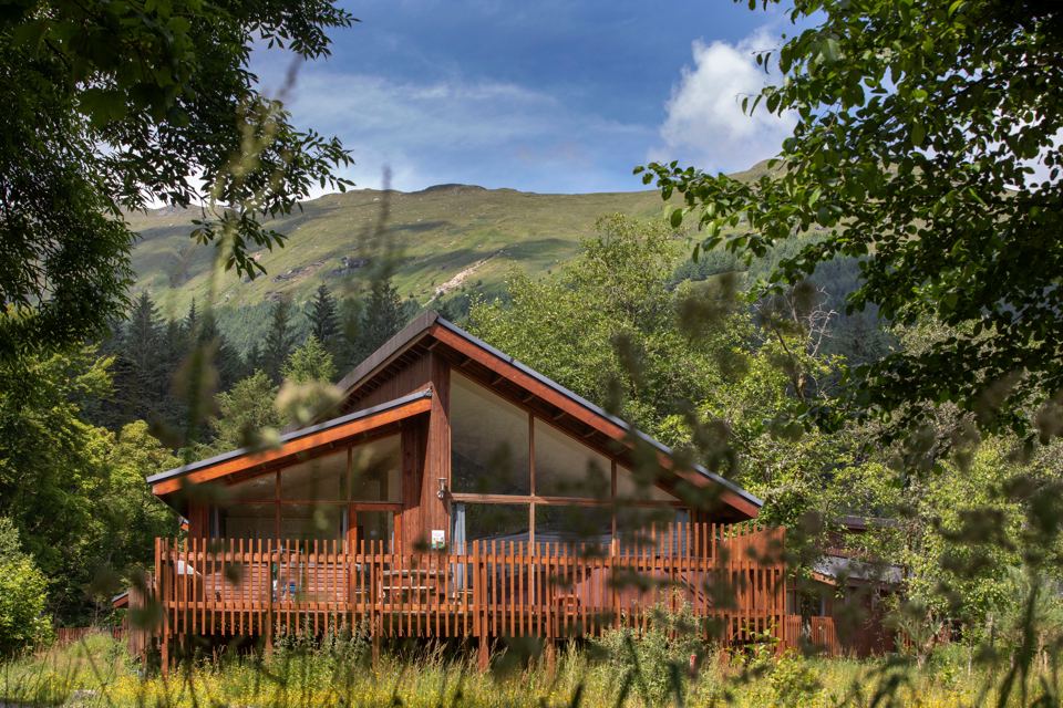 Cabin with decking below the hills