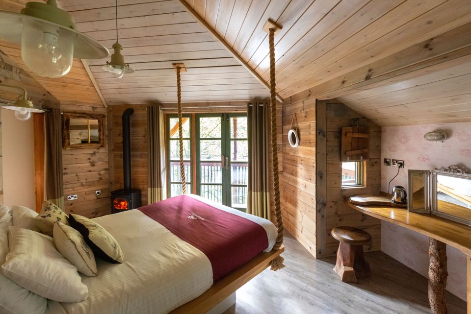 Treehouse bedroom with log burner