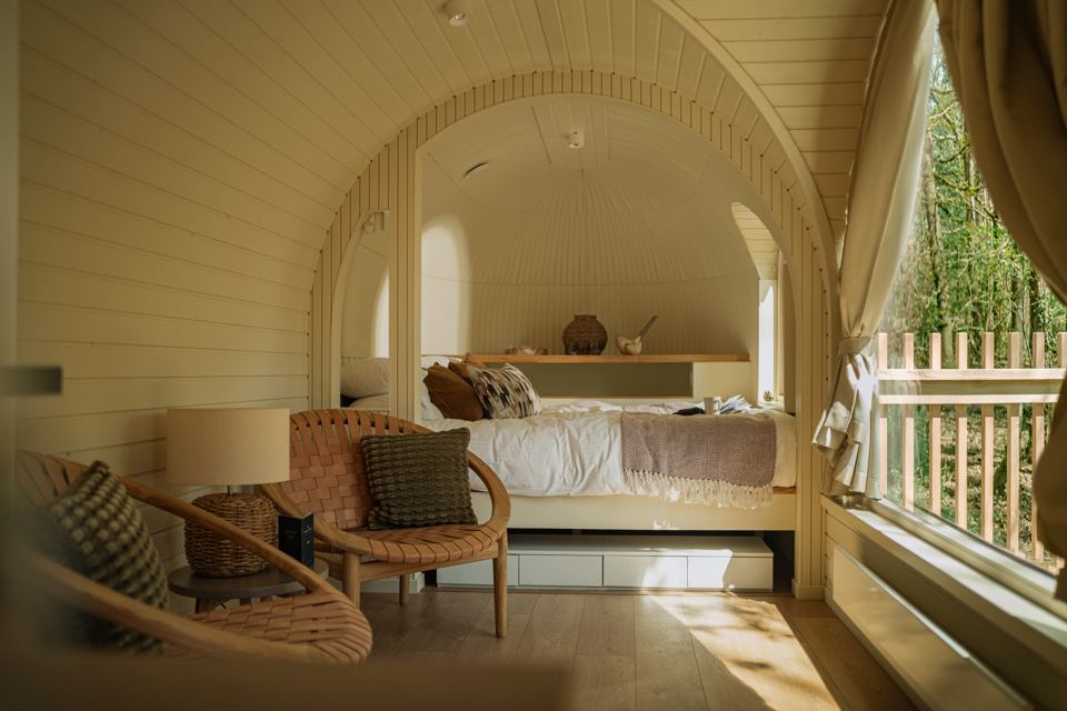 Bedroom with forest window