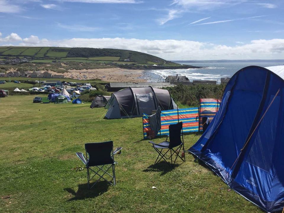 Tents on the field above the beach