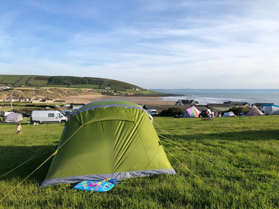 Green tent in the field