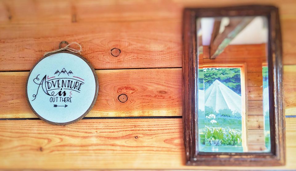 Sign and mirror inside the hut