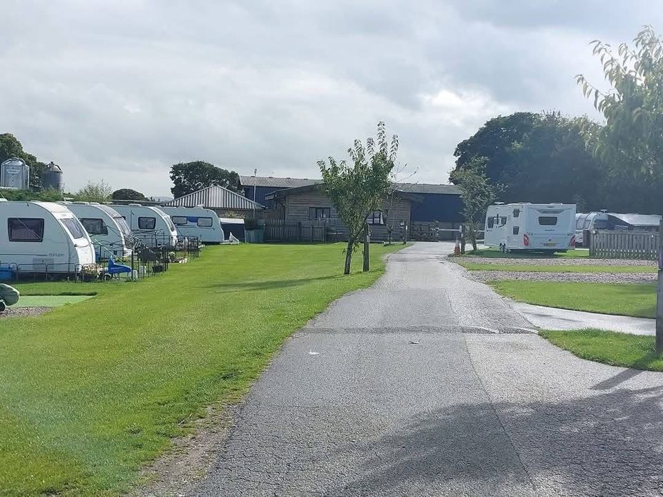 Caravans beside the farm buildings