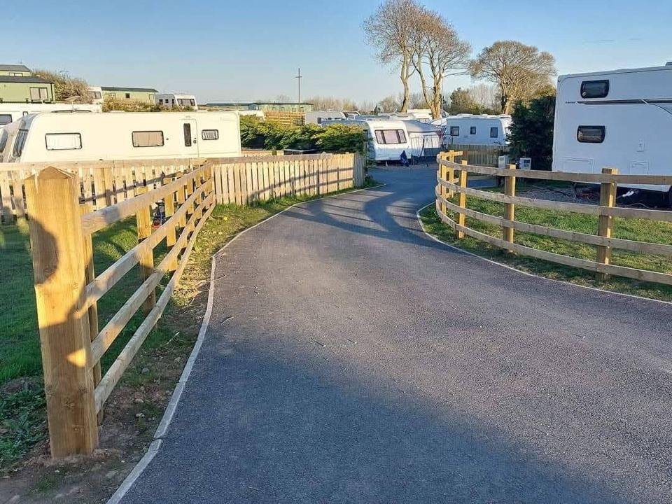 Pitches behind a wooden fence
