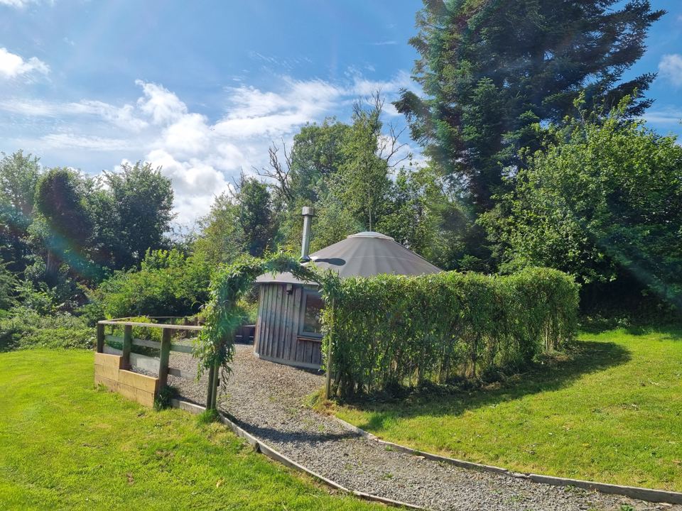 Yurt behind a hedge