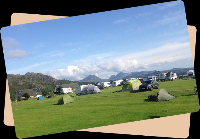 Camping field with tents and vans