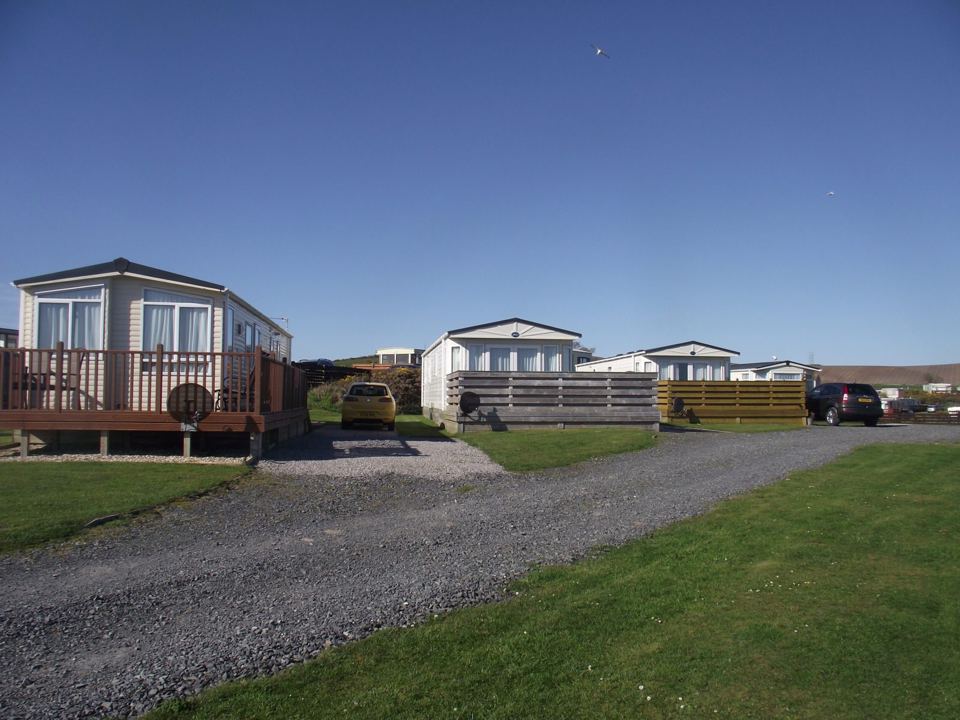 Holiday homes and gravel drive