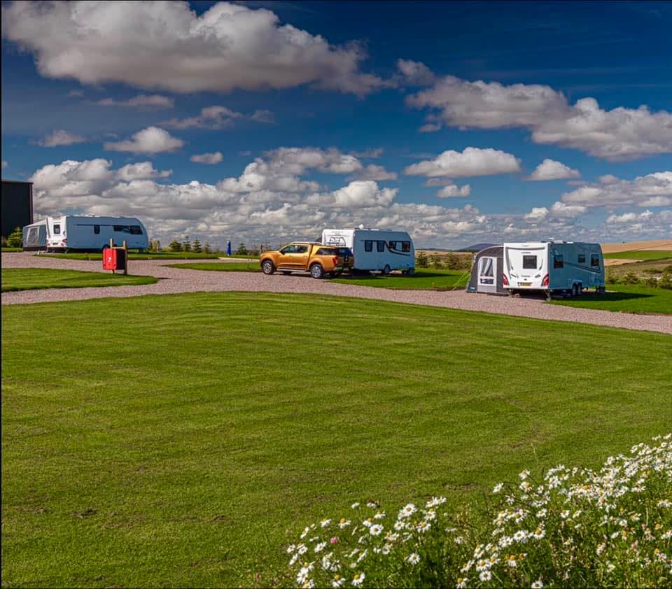 Tourers on the grass and gravel