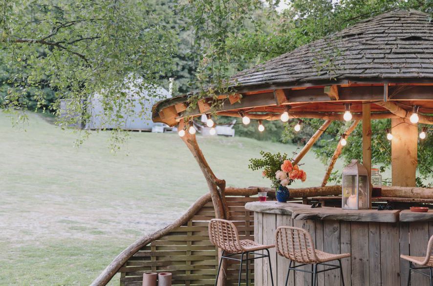 Thatched outdoor bar by the field