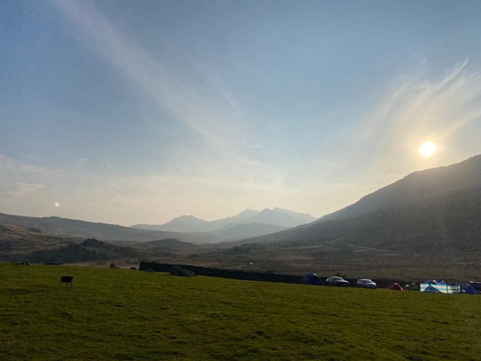 Camping field and mountains