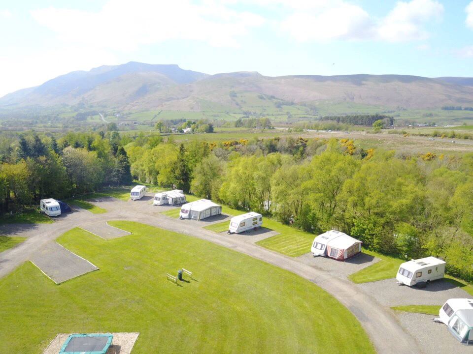 Aerial view of caravan pitches under the hills