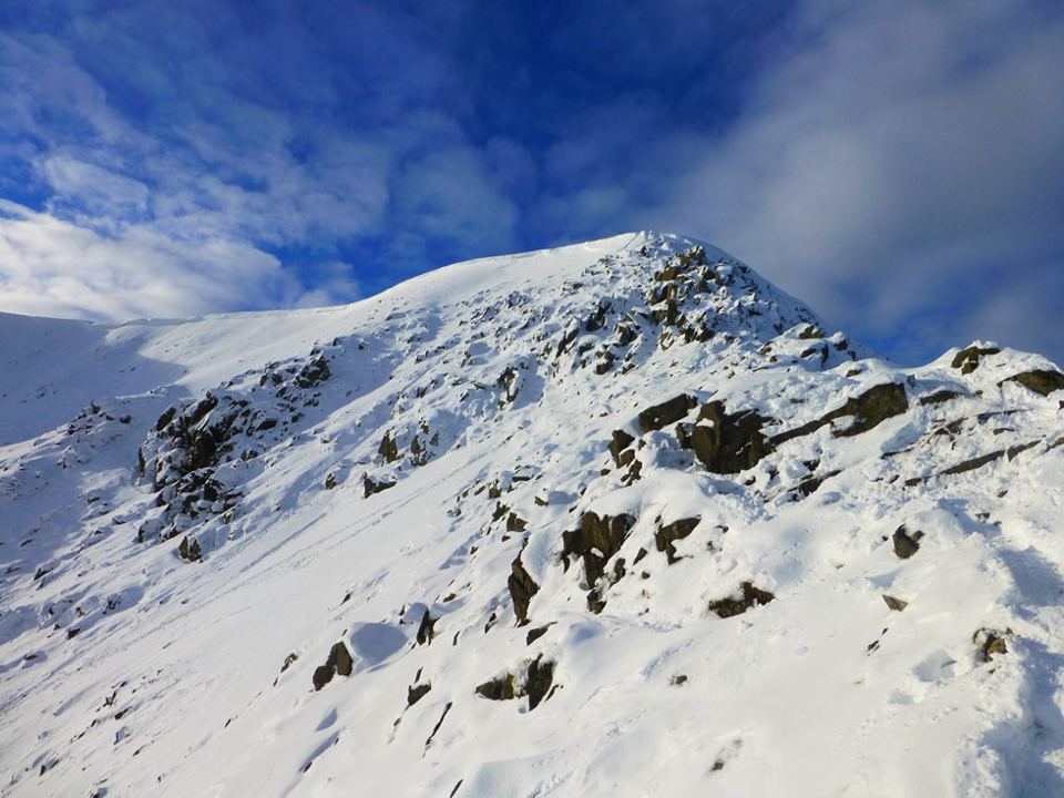 Snow-covered fell above the valley