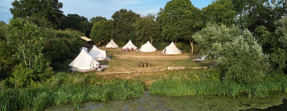 Bell tents beside the lake