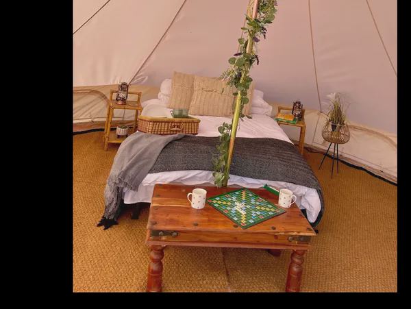 Bed and table inside the tent