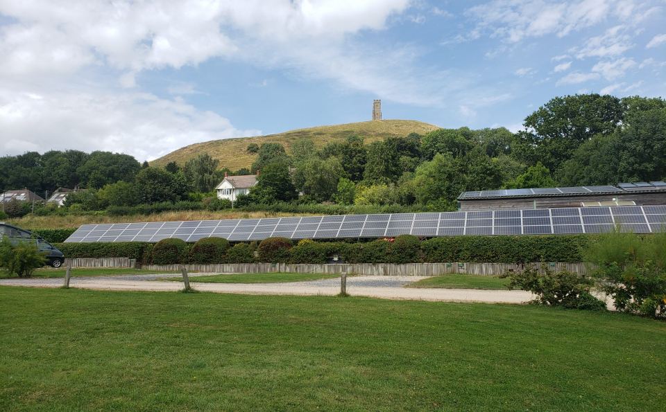 Grass pitches below Glastonbury Tor