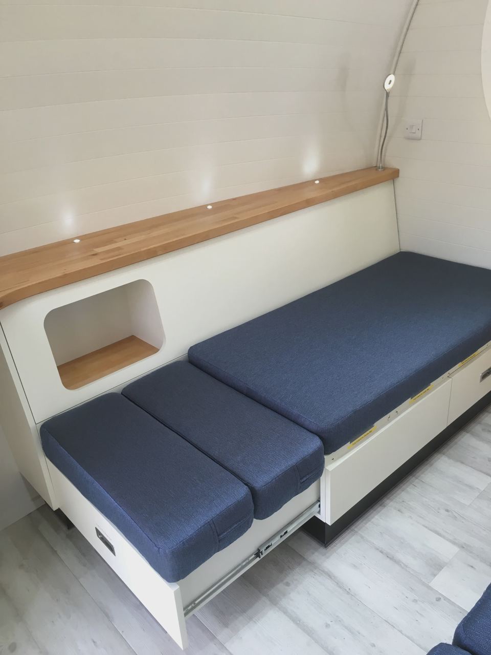 Pod seating that folds to a bed