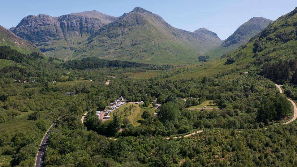Site among the trees below the mountains