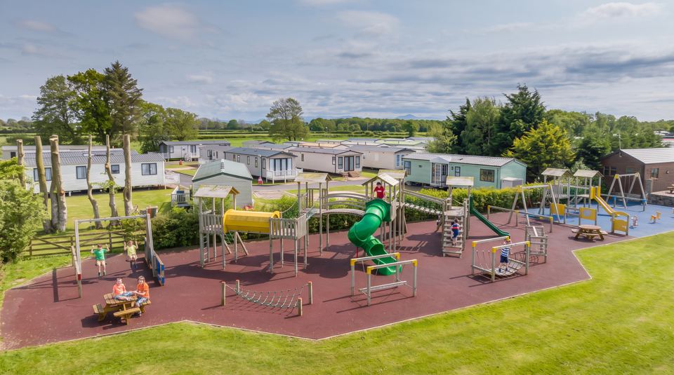 Play area with caravans behind
