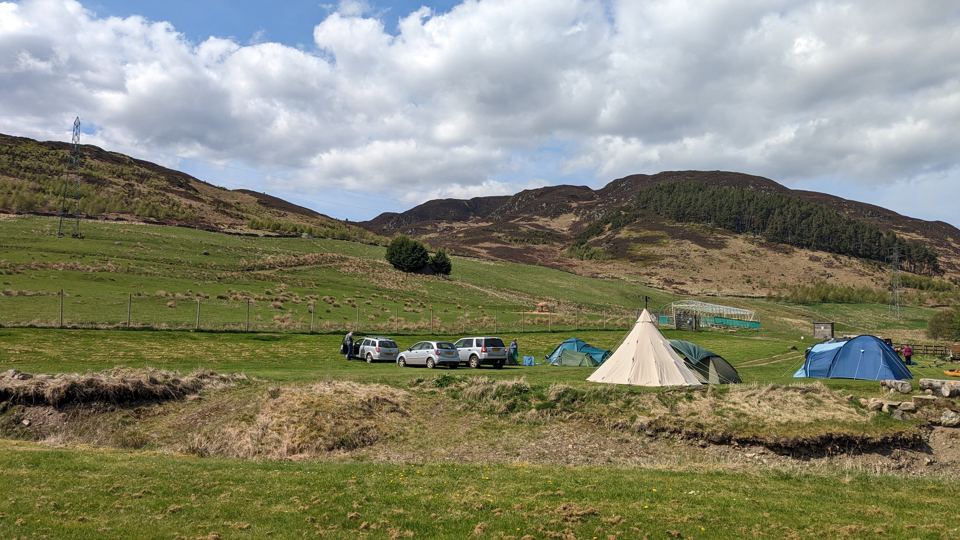 Camping field below the hills