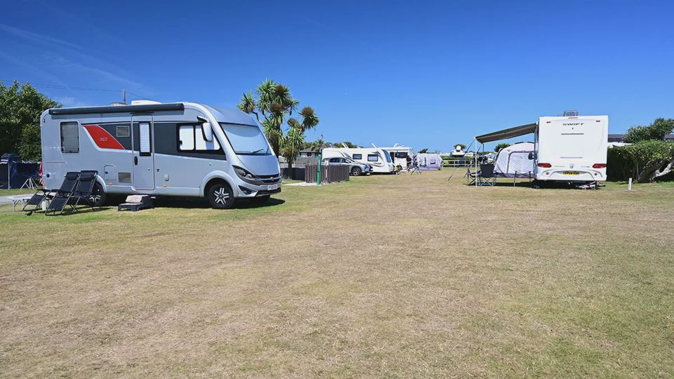 Motorhome and caravans on grass pitches