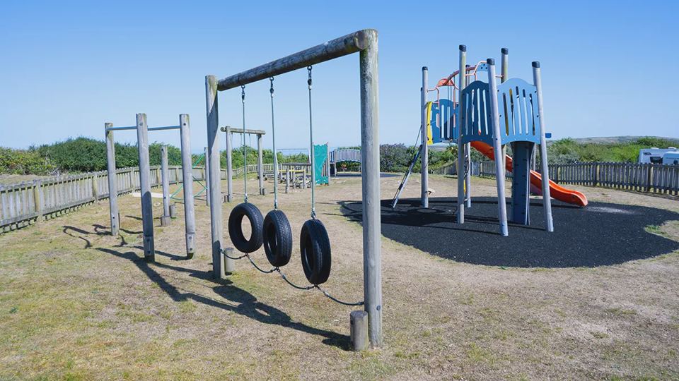 Play area with swings