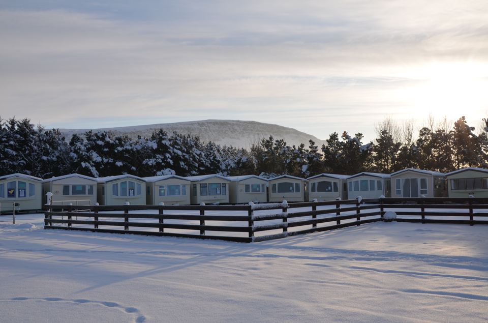 Static caravans behind a fence
