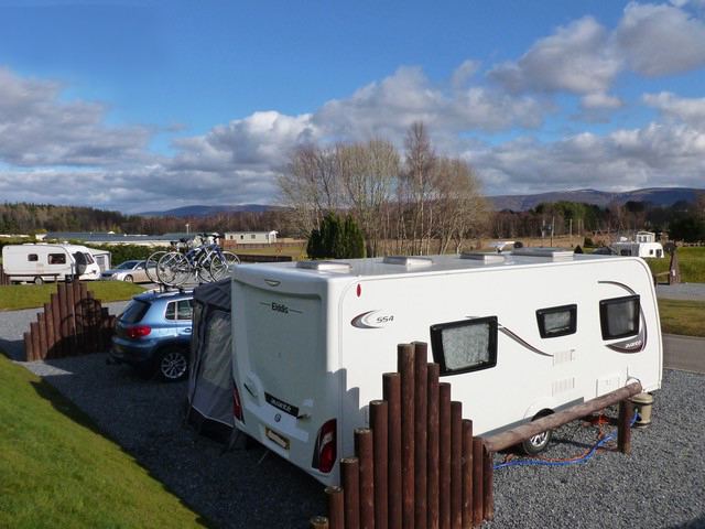 Caravan with hills beyond