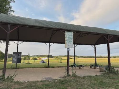 Open barn beside the field