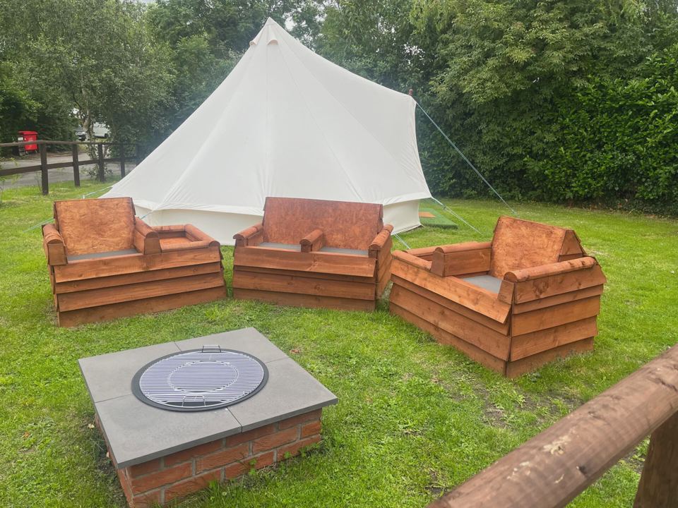 Bell tent and log seating