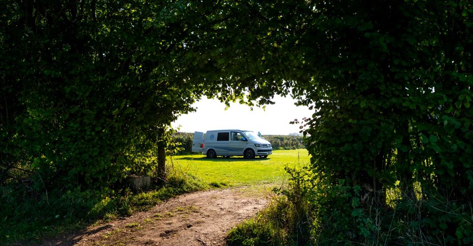 Campervan through a hedge gap