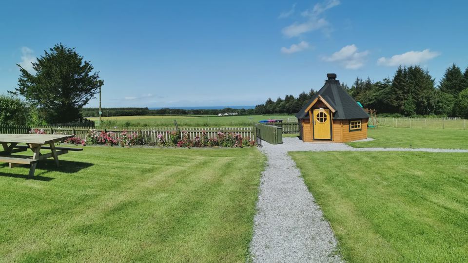 Barbecue hut and picnic bench