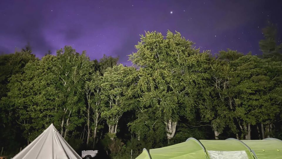 Tents under a night sky