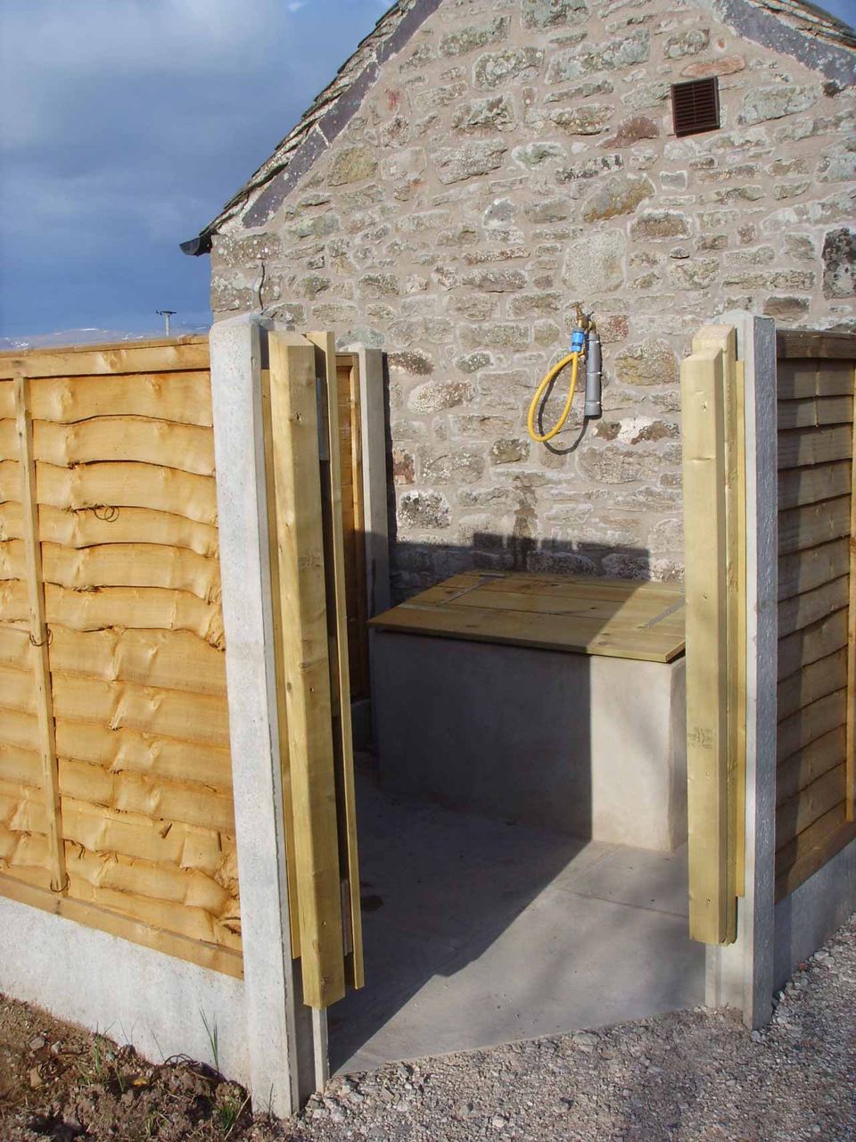Outdoor shower in the stone building