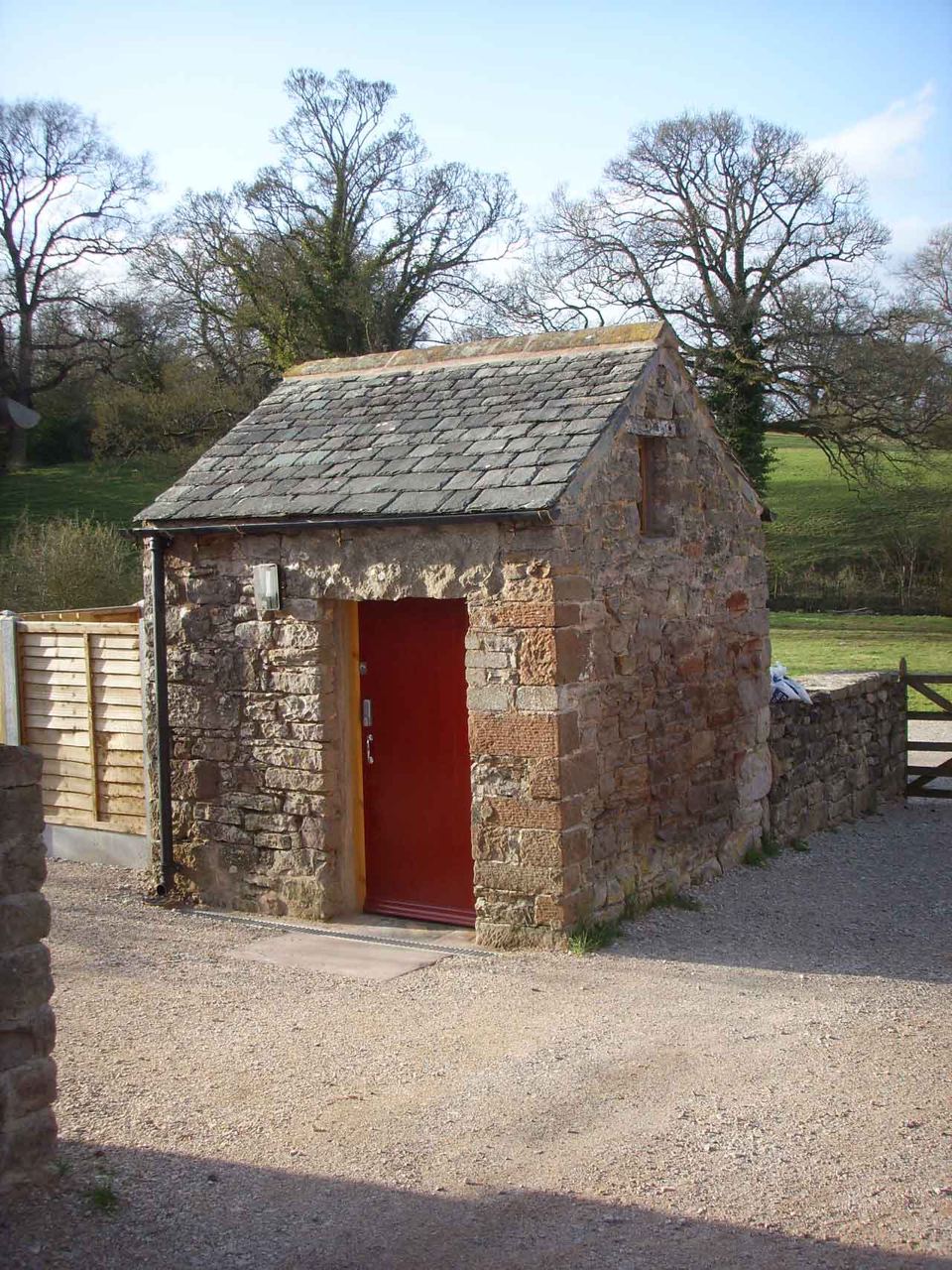 Stone toilet block by the gate