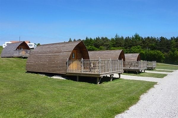 Cabins on gravel and grass