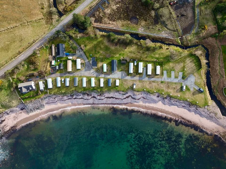 Caravans along the shore from above