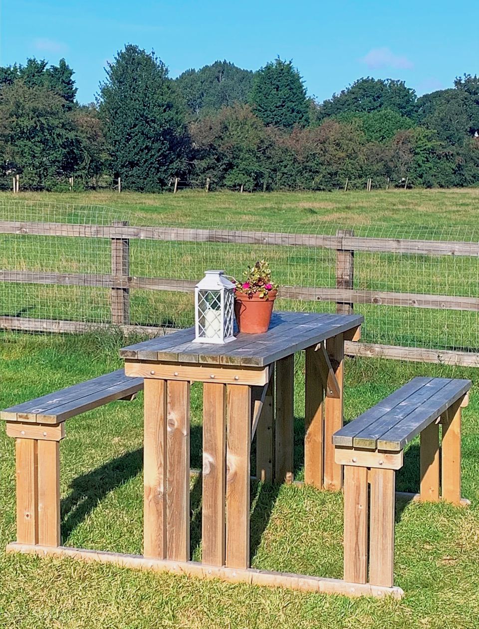 Picnic bench by the field