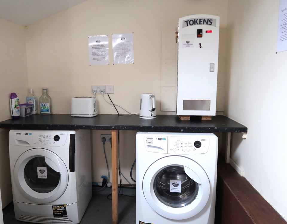 Washing machines and shower tokens