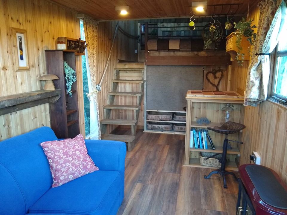 Inside a wagon, sofa and stairs