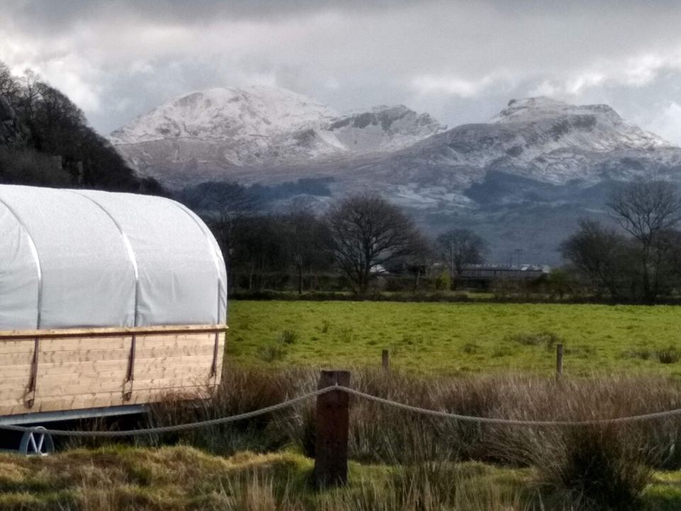 Wagon with Snowdonia peaks behind